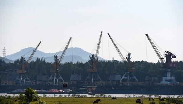 Cranes picking coal at a coal port of Pha Lai thermal power plant in Hai Duong province (AFP)