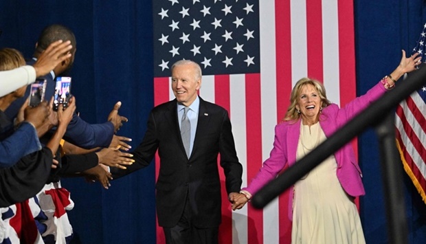 US President Joe Biden and First Lady Jill Biden arrive for a rally for gubernatorial candidate Wes Moore and the Democratic Party on the eve of the US midterm elections (AFP)