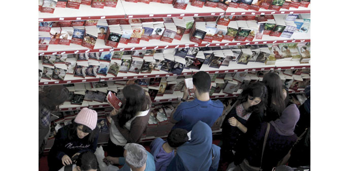 People look at books during the 20th International Book Fair in Algiers.