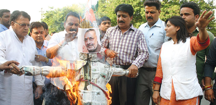 Congress activists burn an effigy of federal minister Giriraj Singh over his remark on party chief Sonia Gandhi, during a protest in Bhopal yesterday.