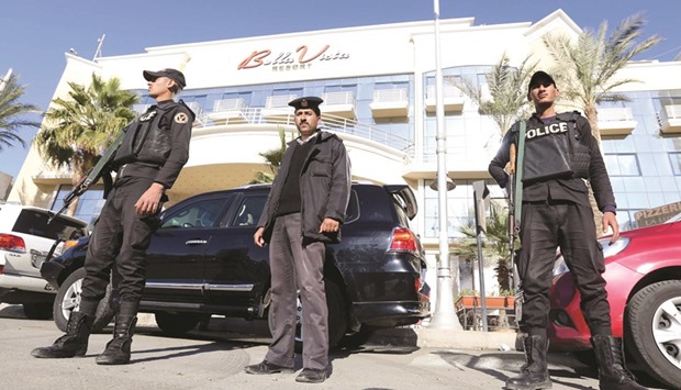 Egyptian security personnel guard the entrance to the Bella Vista Hotel in the Red Sea resort of Hurghada, Egypt, yesterday. Two armed assailants attacked the hotel on Friday, wounding three foreign tourists.