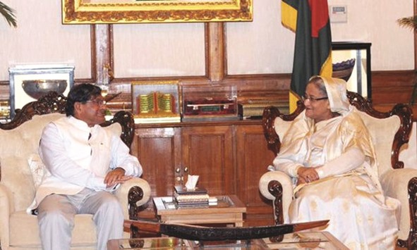 Bangladesh Prime Minister Sheikh Hasina talks to Manik Dey, a minister of Indian State of Tripura, in Dhaka yesterday.