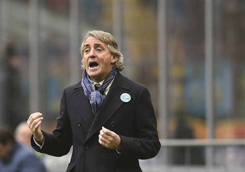 Inter Milan coach Roberto Mancini shouts as he gestures during his teamu2019s Italian Serie A match against Sassuolo yesterday at San Siro stadium in Milan.