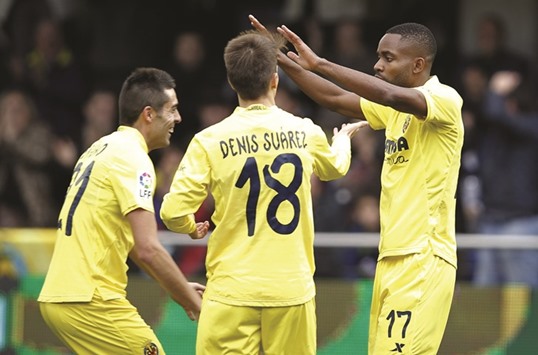 Villarreal striker Cedric Bakambu (R) celebrates a goal yesterday.