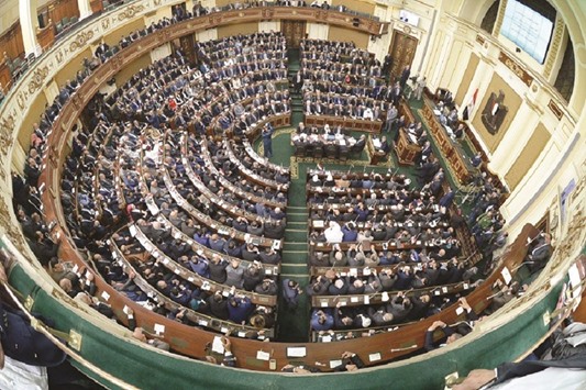 A general view taken yesterday shows members of Egyptu2019s new parliament meeting during their inaugural session in Cairo.