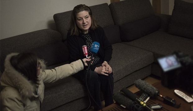 Ursula Gauthier, the Beijing-based correspondent for French news magazine L'Obs, speaks to journalists before she leaves her apartment to take her flight back to France, in Beijing yesterday. AFP