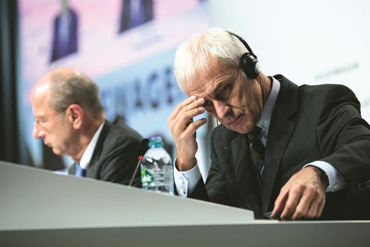 Volkswagen CEO Matthias Mueller (right) reacts during a news conference with chief financial officer of VW Hans Dieter in Wolfsburg on December 10. u201cWe know that we have let down customers, authorities, regulators and the general public here in America,u201d Mueller said at a media reception on the eve of the Detroit auto show on Sunday.