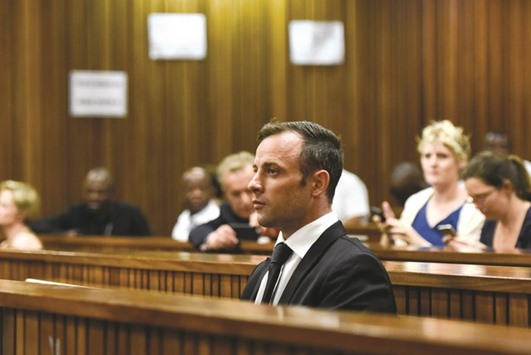 This file photo taken on December 08, 2015 shows Pistorius sitting in the South African Gauteng Division High Court in Pretoria, ahead of his hearing.
