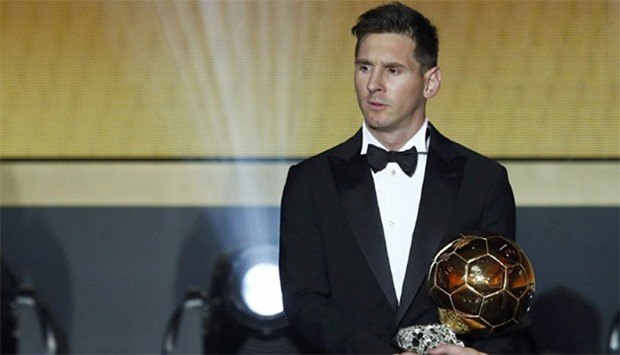 FC Barcelona's Lionel Messi of Argentina holds the World Player of the Year award during the FIFA Ba