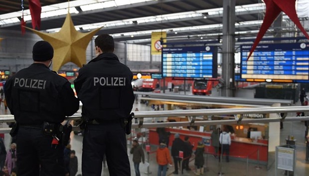 Police officers patrol at the main train station in Munich on Friday. German police lifted an alert of an imminent attack in Munich, hours after two key train stations were evacuated over fears that a New Year suicide bomb assault was being planned.