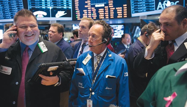 Traders work on the floor of the New York Stock Exchange. The S&P 500 dropped 0.9% to close the year out with a 0.7% loss.