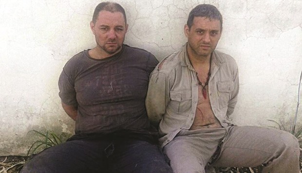 Argentine fugitives Cristian Lanatta (left) and Victor Schillaci after detained in Cayasta, Santa Fe province yesterday.