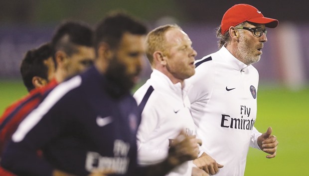 File picture of PSG coach Laurent Blanc (R) during a training session.