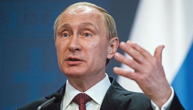 Russiau2019s President Vladimir Putin gestures whilst speaking during a news conference in Budapest (file). Ukraine had announced last month it would not make payment on its debt to Moscow after Putin vowed to sue Kiev if it failed to pay by the end of 2015.