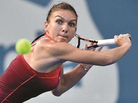 Simona Halep hits a return against Caroline Garcia during their match at the Sydney International tournament in Sydney. (AFP)