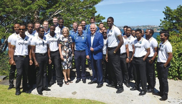 Australiau2019s Prime Minister Malcolm Turnbull (centre) and his wife Lucy pose for a photo with the West Indies and Australian cricketers at a New Yearu2019s Day reception for the team at Kirribilli House in Sydney yesterday. (AFP)