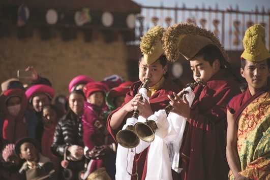 A recent picture at the Ganden Sumtsenling Monastery in Shangri-La, Diqing Tibetan Autonomous Prefecture of southwest Chinau2019s Yunnan Province, shows lamas playing traditional instruments during the Gedong festival.