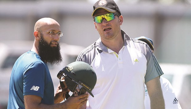 Former South Africa captain Graeme Smith (right) chats with current skipper Hashim Amla during a net session in Cape Town.