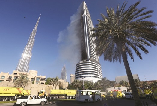 Plumes of smoke rise from the 63-storey Address Downtown Dubai hotel