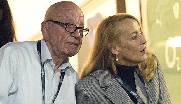 Australian-born media magnate Rupert Murdoch (L) and former US model Jerry Hall watching the action during the final match of the Rugby World Cup between New Zealand and Australia at Twickenham stadium in southwest London, on October 31, 2015.
