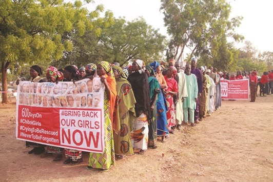 Members of the u201cBringBackOurGirlsu201d movement and mothers of the missing schoolgirls march to press for the release of the schoolgirls kidnapped in 2014.