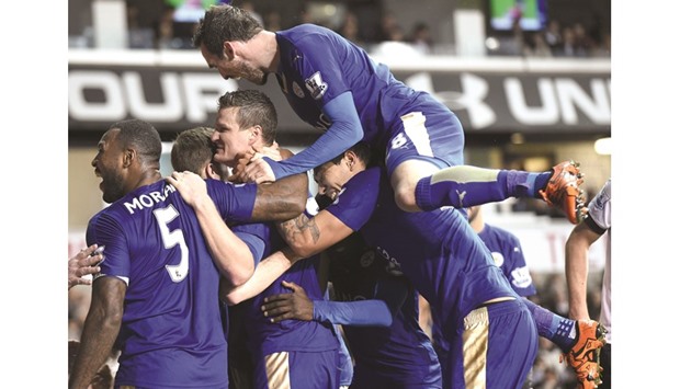 Leicester City players celebrate after scoring against Tottenham Hotspur at the White Hart Lane.