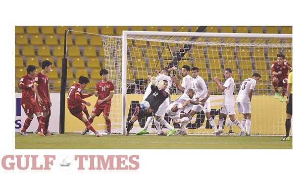 Vietnamu2019s Le Thanh Binhu2019s free kick is blocked by Jordanu2019s goalkeeper Yazeed Moien Hasan Abulaila during the AFC U-23 championship at the Qatar Sports Club yesterday. PICTURES: Nousahd Thekkayil