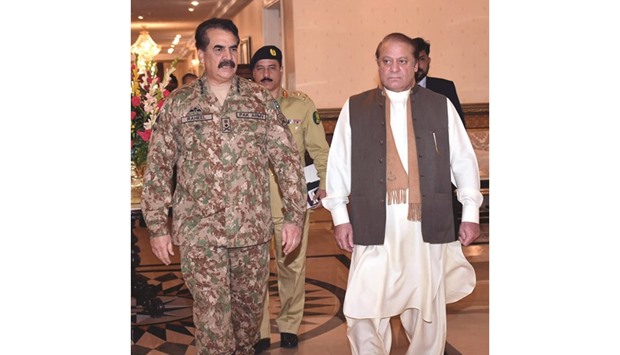 Pakistanu2019s Prime Minister Nawaz Sharif arrives with Pakistan Army Chief of Staff General Raheel Sharif for a high-level meeting at the Prime Minister House in Islamabad on Wednesday.  Pakistan said it has arrested several militants belonging to the group believed to be behind a fatal attack on an Indian air base, a move that could help soothe irritated relations with New Delhi.