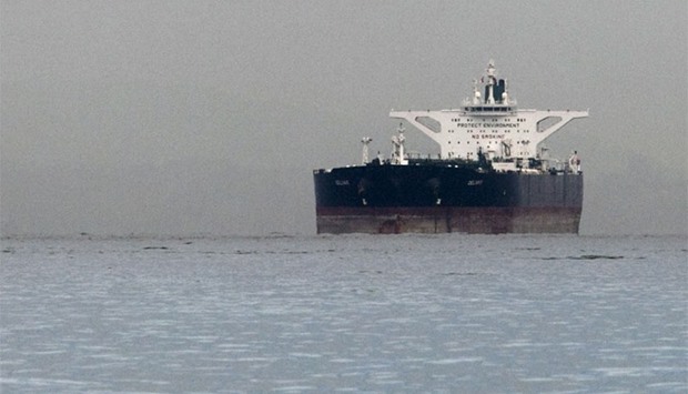 Malta-flagged Iranian crude oil supertanker ,Delvar, is seen anchored off Singapore in this March 1, 2012 file photo. With Iran poised to resume usual business ties with the world under a historic nuclear deal, Tehran is set to target India, Asia's fastest-growing major oil market, and old partners in Europe with hundreds of thousands of barrels of its crude.  Reuters