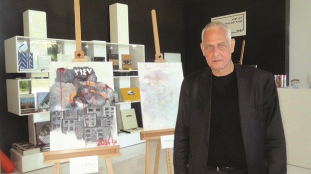 Tuymans poses with some of the artworks.