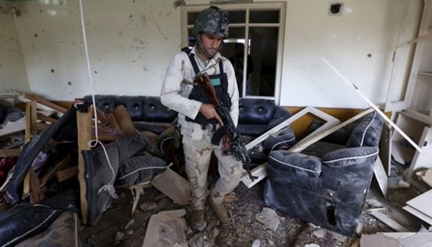 Representational photo: A member of the Afghan security force inspects a damaged building after a blast near the Pakistani consulate in Jalalabad, Afghanistan, on 13 January, 2016. Reuters