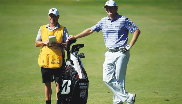 Brandt Snedeker and his caddie Scott Vail wait on the sixth hole during the third round of the Sony Open. (AFP)