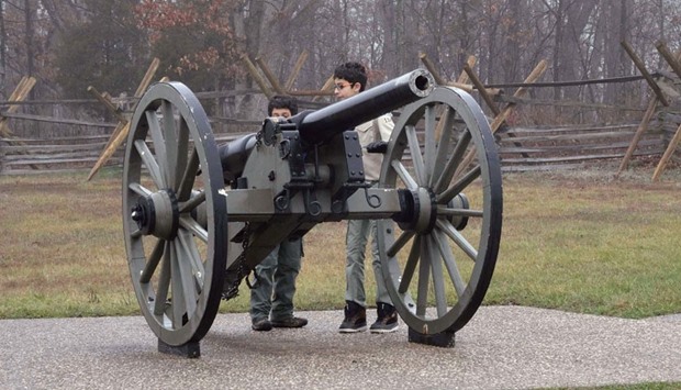 Scouts from Troop 114 look at a cannon at the Gettysburg Museum of the American Civil War in Gettysburg, Pennsylvania.