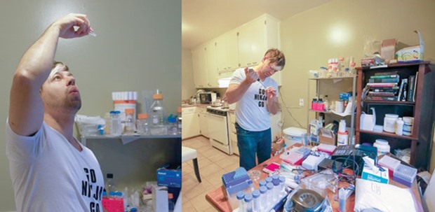 BEHIND CLOSED DOORS: Scientist Josiah Zayner, 34, looks at the genetically engineered bacteria to make sure it is mixed well, in his home lab in Burlingame, California. Right: GIFT OF THE LAB: Josiah Zayner pipetting solutions for bacterial engineering in his home lab.