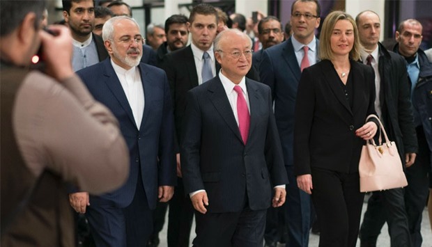 International Atomic Energy Agency (IAEA) chief Yukiya Amano (C), Iranian Foreign Minister Mohammad Javad Zarif (L) and EU foreign policy chief Federica Mogherini (R) arrive for a press conference at the E3/EU+3 and Iran talks at the International Atomic Energy Agency headquarters in Vienna. AFP
