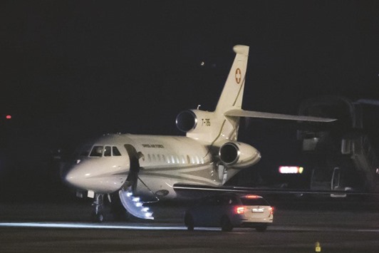 A man disembarks from a Falcon 900 of the Swiss Air Force, after it landed at Genevau2019s airport, yesterday.
