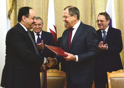 HE the Foreign Minister Dr Khalid bin Mohamed al-Attiyah and Russian Foreign Minister Sergey Lavrov shake hands after signing an agreement in Moscow yesterday.