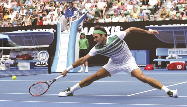 Roger Federer stretches to hit a return to Ukraine's Alexandr Dolgopolov during their second round match at the Australian Open yesterday. (Reuters)