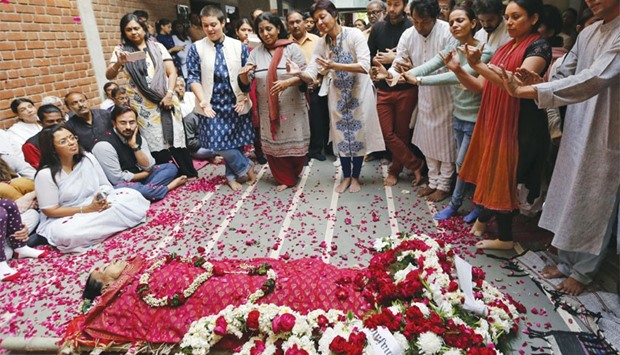 Mallika Sarabhai performs along with her students as part of homage next to the body of her mother and classical dancer Mrinalini Sarabhai before her cremation in Ahmedabad, yesterday.