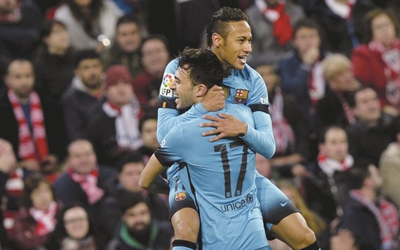 Barcelonau2019s Neymar celebrates his goal against Athletic Bilbao with teammate Munir el Haddadi.