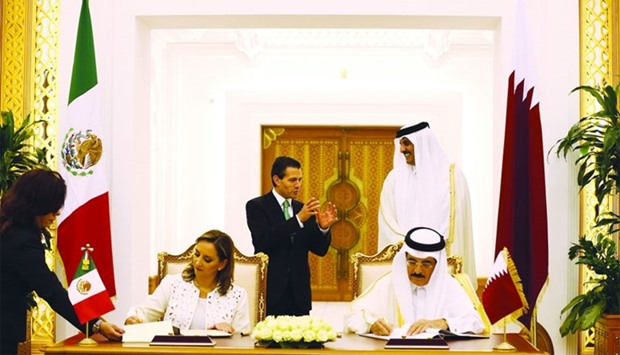 HH the Emir Sheikh Tamim bin Hamad al-Thani and Mexican President Enrique Pena Nieto witness the signing of an agreement at the Emiri Diwan on Thursday.