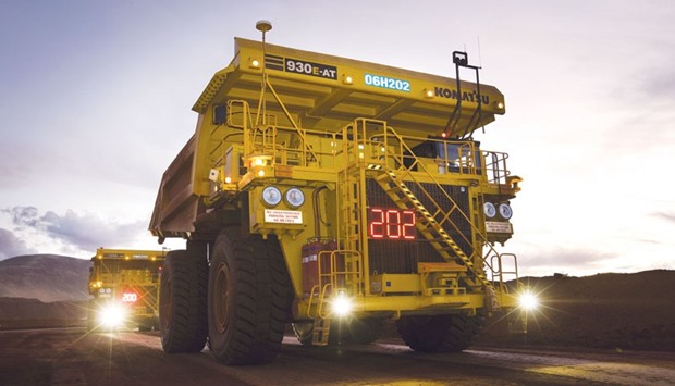Autonomous haulage trucks operate at a mine in the Pilbara area of Western Australia.