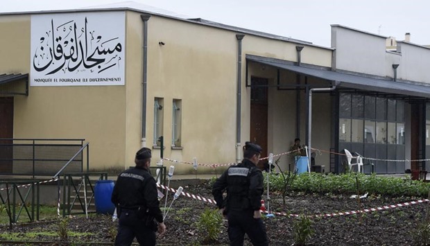 French gendarmes patrol in front of the mosque of Valence on Saturday, a day after a driver was shot and wounded as he drove a car at four soldiers guarding the mosque.