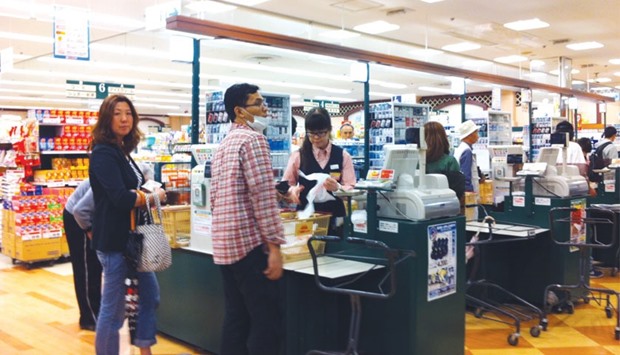 Shoppers at a supermarket in Tokyo. Doubts over the efficacy of Japan Prime Minister Shinzo Abeu2019s cocktail of monetary easing, fiscal stimulus and structural reforms have been growing for several months as the worldu2019s third-largest economy fails to motor on and inflation remains a long way off the Bank of Japanu2019s 2% goal.