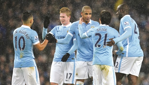 Manchester City players celebrate a goal during their 4-0 win over Crystal Palace in the English Premier League in Manchester on Saturday. (AFP)