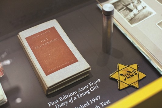 This file photo taken on March 26, 2012 shows a copy of the first edition of Anne Frank: Diary of a Young Girl, displayed at the Anne Frank Centre USA in New York City.