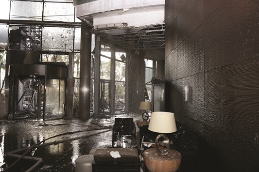 A handout picture taken by the Government of Dubai Media Office on January 1, 2016, shows the damaged lobby of the Address Downtown Hotel in Dubai.