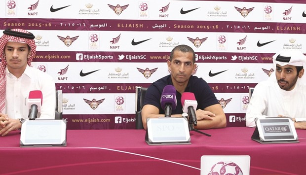 El Jaish coach Sabri Lamouchi (C) speaks to the press.