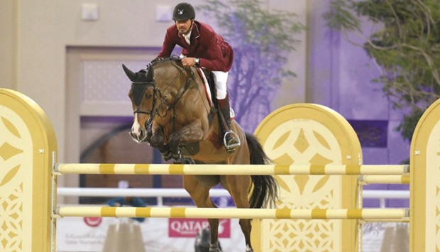 Qataru2019s Sheikh Ali bin Khalid al-Thani clears a hurdle during the Al Rayyan International Show Jumping Championship 2016 at the Qatar Equestrian Federation outdoor arena yesterday. PICTURES: Garsi Lotfi