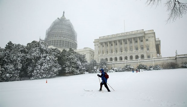A man skis on the West Front Lawn of the US Capitol January 23, 2016 in Washington, DC